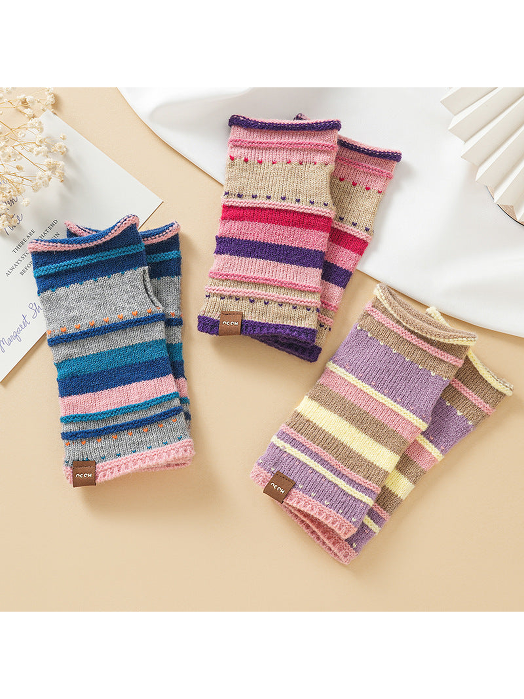 Three striped fingerless glove colorways arranged together