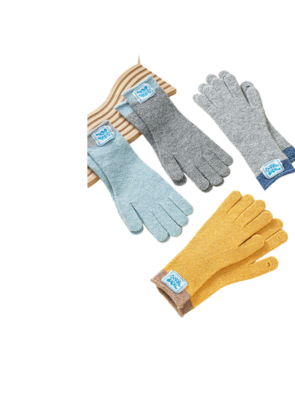 Multiple colors of knit gloves displayed together