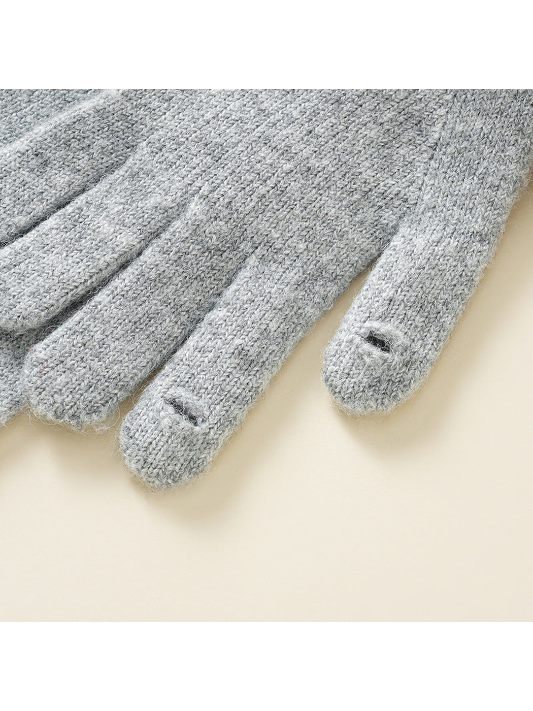 Close-up of small access slits near two glove fingertips