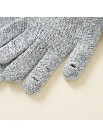 Close-up of small access slits near two glove fingertips