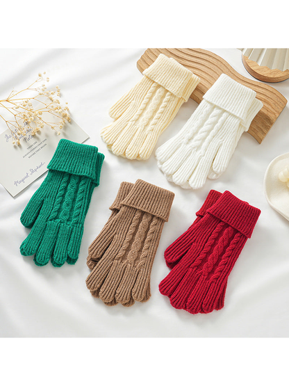 Green, ivory, white, brown and red cable-knit gloves displayed together