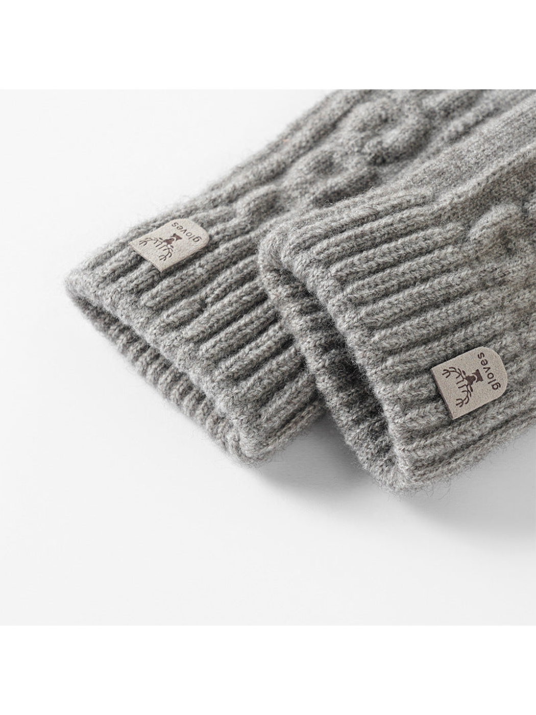 Close-up of ribbed glove cuffs and sewn deer labels