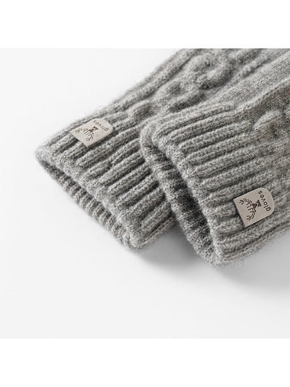 Close-up of ribbed glove cuffs and sewn deer labels