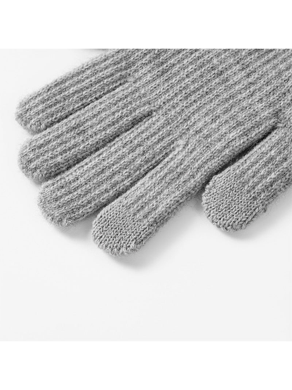 Close-up of the smooth-knit thumb and index fingertip panels on gray gloves