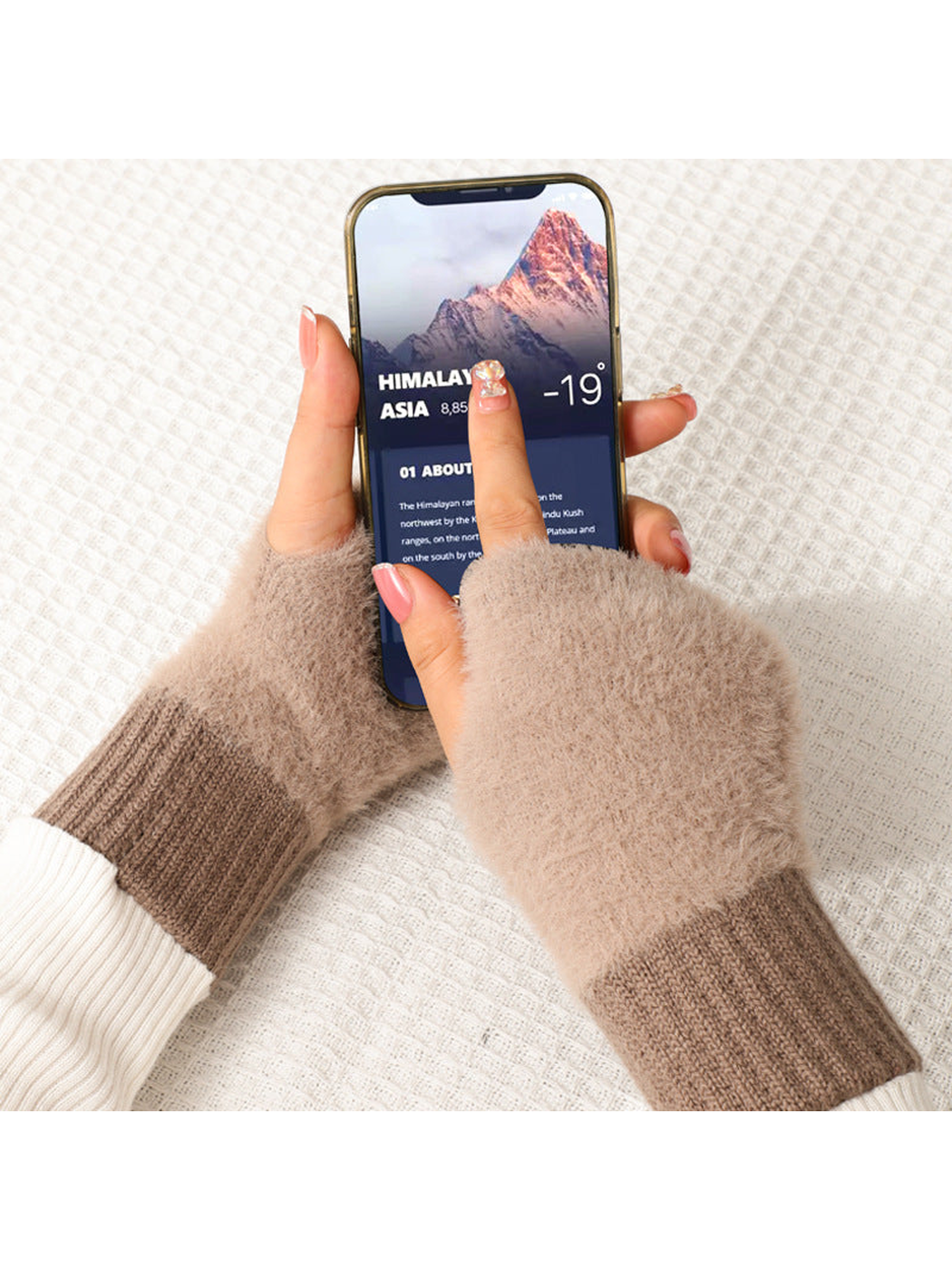 Brown fuzzy fingerless gloves used with a smartphone