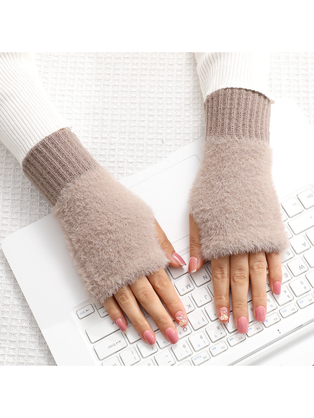Deep brown fuzzy fingerless gloves worn over the hands
