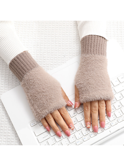 Deep brown fuzzy fingerless gloves worn over the hands