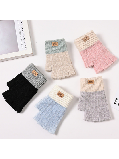 Five colorblock fingerless glove styles in a flat lay