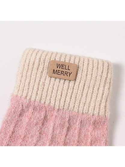Close-up of the ribbed cuff, fuzzy knit texture and logo patch