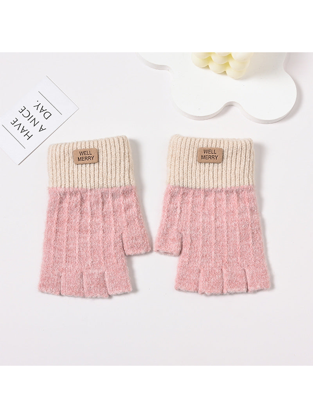 Pink fingerless gloves with cream ribbed cuffs