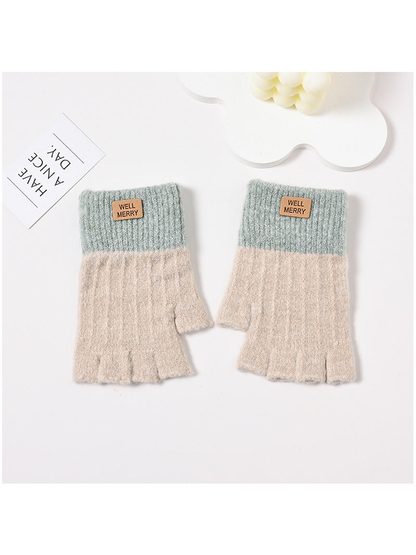 Beige fingerless gloves with muted green ribbed cuffs