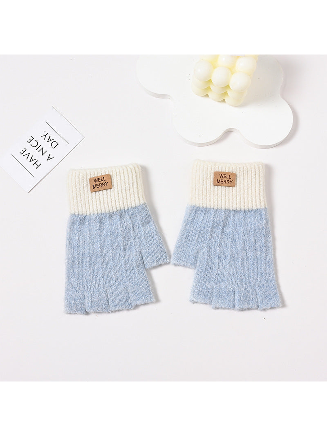 Light blue fingerless gloves with cream ribbed cuffs