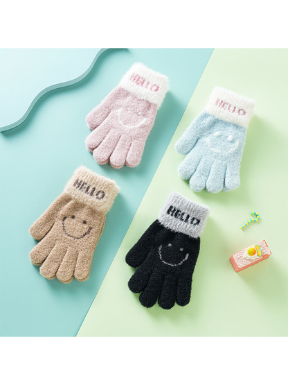 Pink, blue, camel and black fuzzy gloves with smiley motifs displayed together