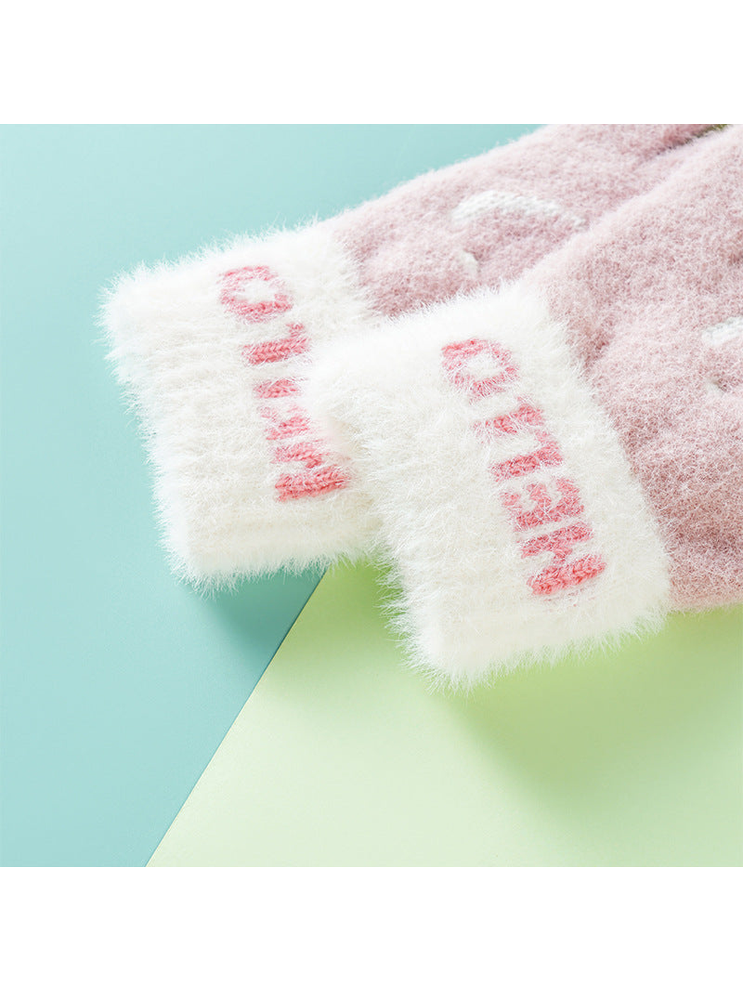 Close-up of the contrasting white cuffs with pink lettering