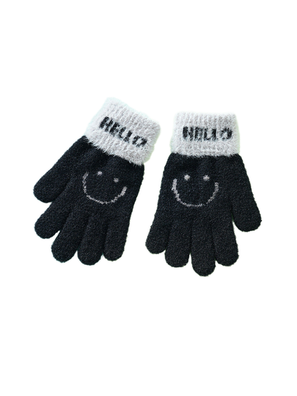 Pair of black fuzzy gloves with gray cuffs and smiley motifs
