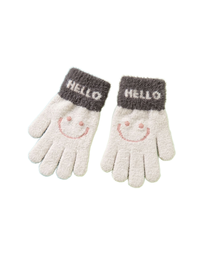 Pair of beige fuzzy gloves with dark gray cuffs and smiley motifs