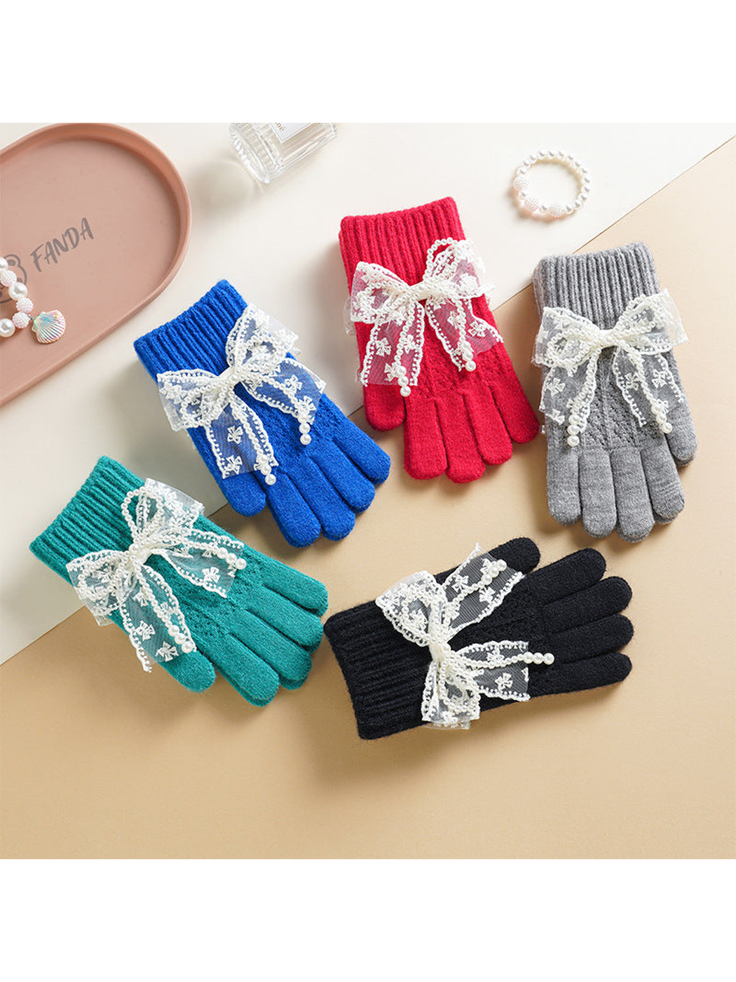 Red, blue, gray, turquoise and black bow-accent gloves displayed together