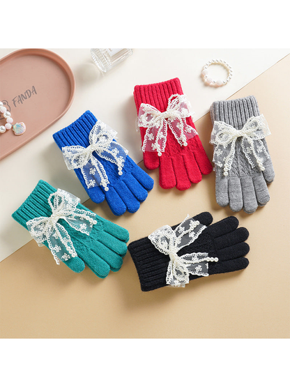 Red, blue, gray, turquoise and black bow-accent gloves displayed together