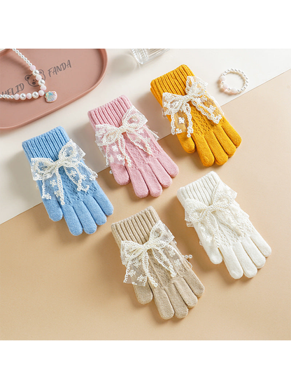 Light blue, pink, yellow, white and beige bow-accent gloves displayed together