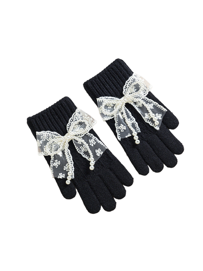 Black gloves with ribbed cuffs and lace bows