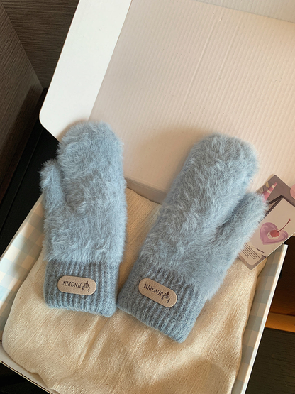 Light blue fuzzy mittens with ribbed cuffs