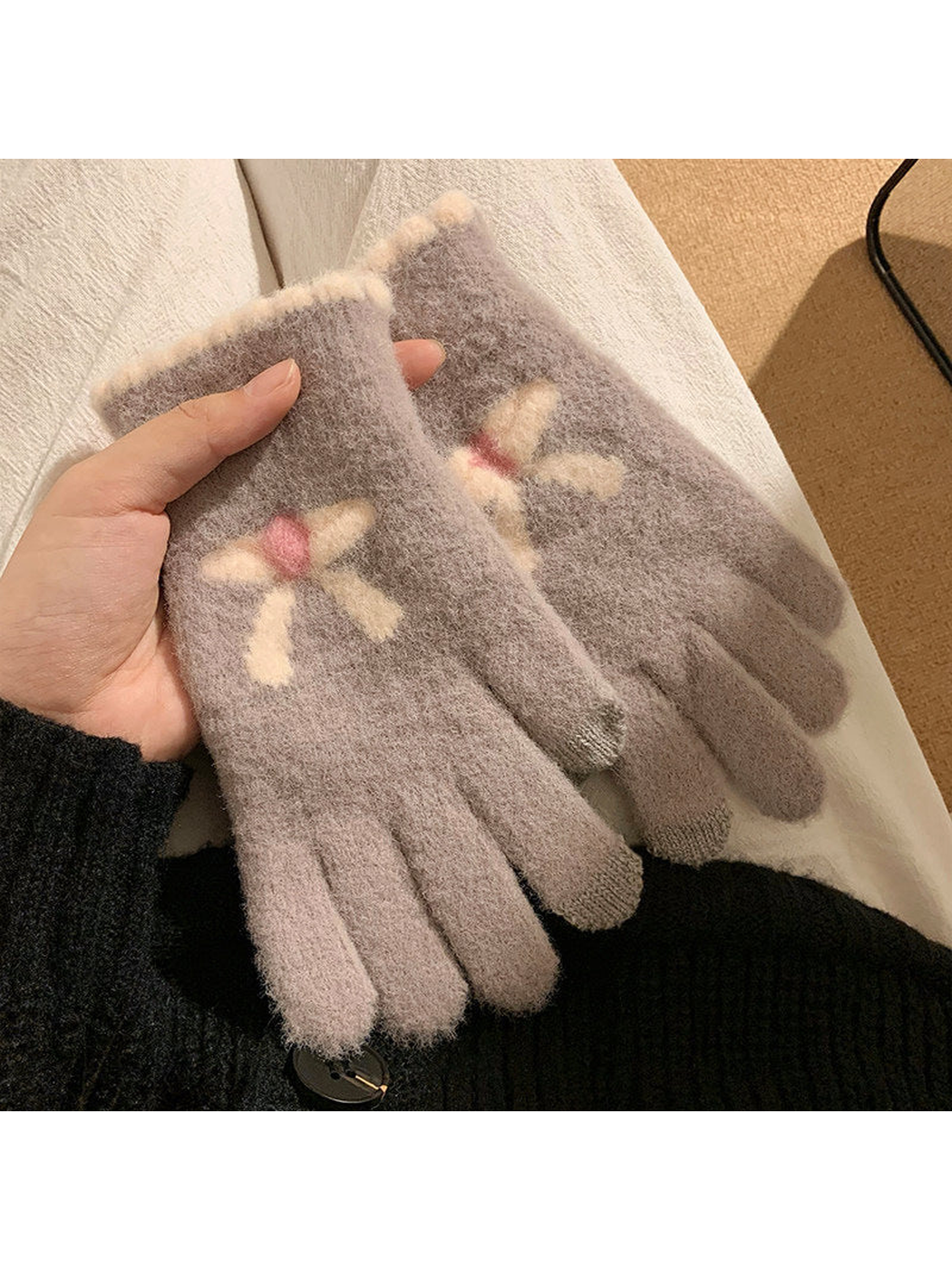 Gray fuzzy gloves with raised bow motifs