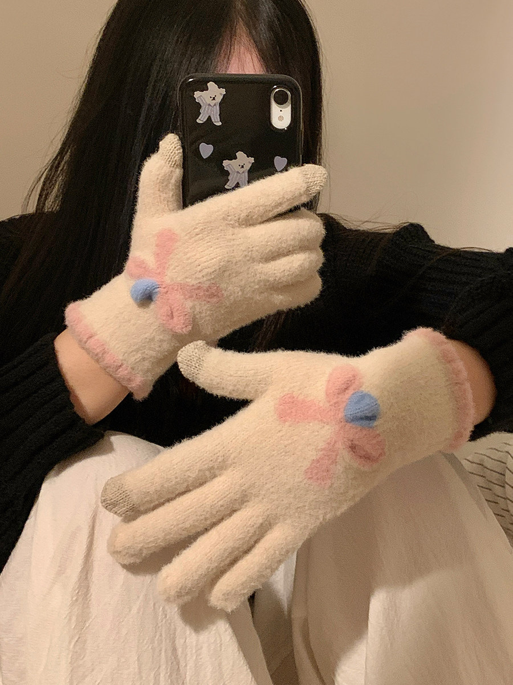 Ivory fuzzy gloves with raised pink flower motifs