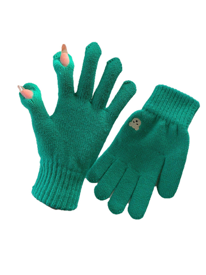 Green knit gloves with open thumb and index fingertips and a small embroidered motif