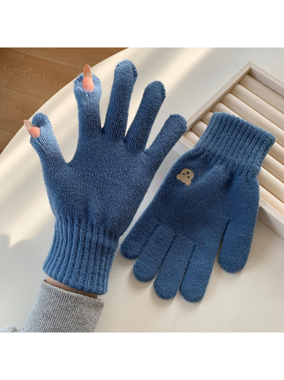 Blue knit gloves with open thumb and index fingertips
