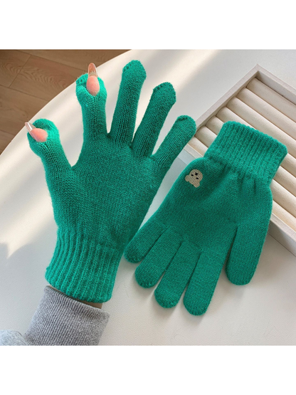 Green knit gloves with open thumb and index fingertips