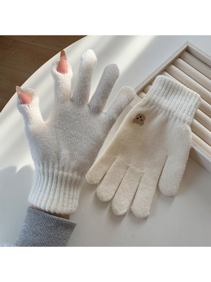 White knit gloves with open thumb and index fingertips