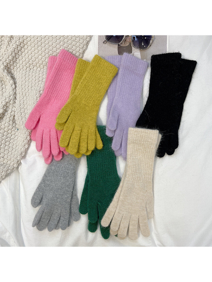 Seven colors of extended-cuff gloves displayed together