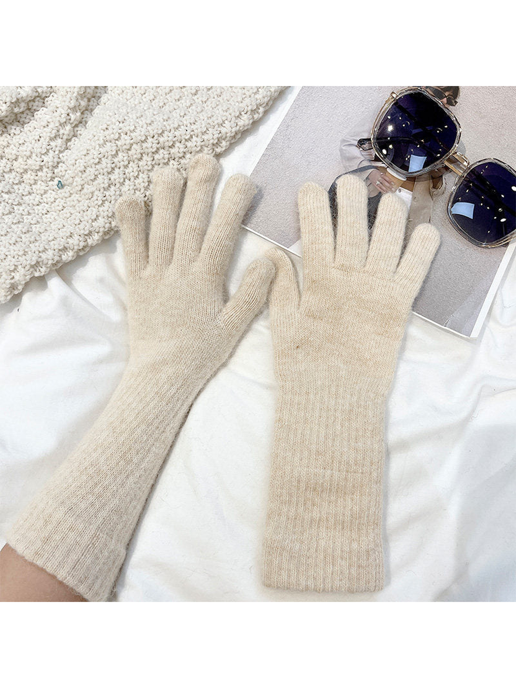 Beige extended-cuff gloves worn on both hands