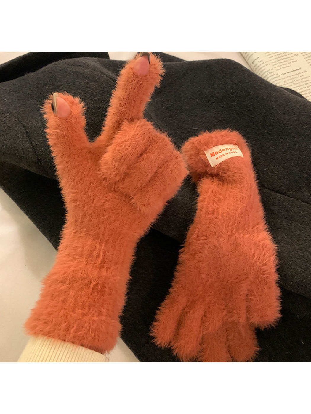 Rust-colored fuzzy gloves with thumb and index fingertip openings