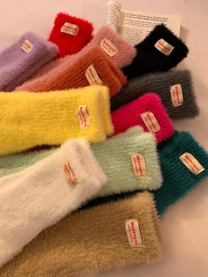 Close view of fuzzy glove cuffs and their color range