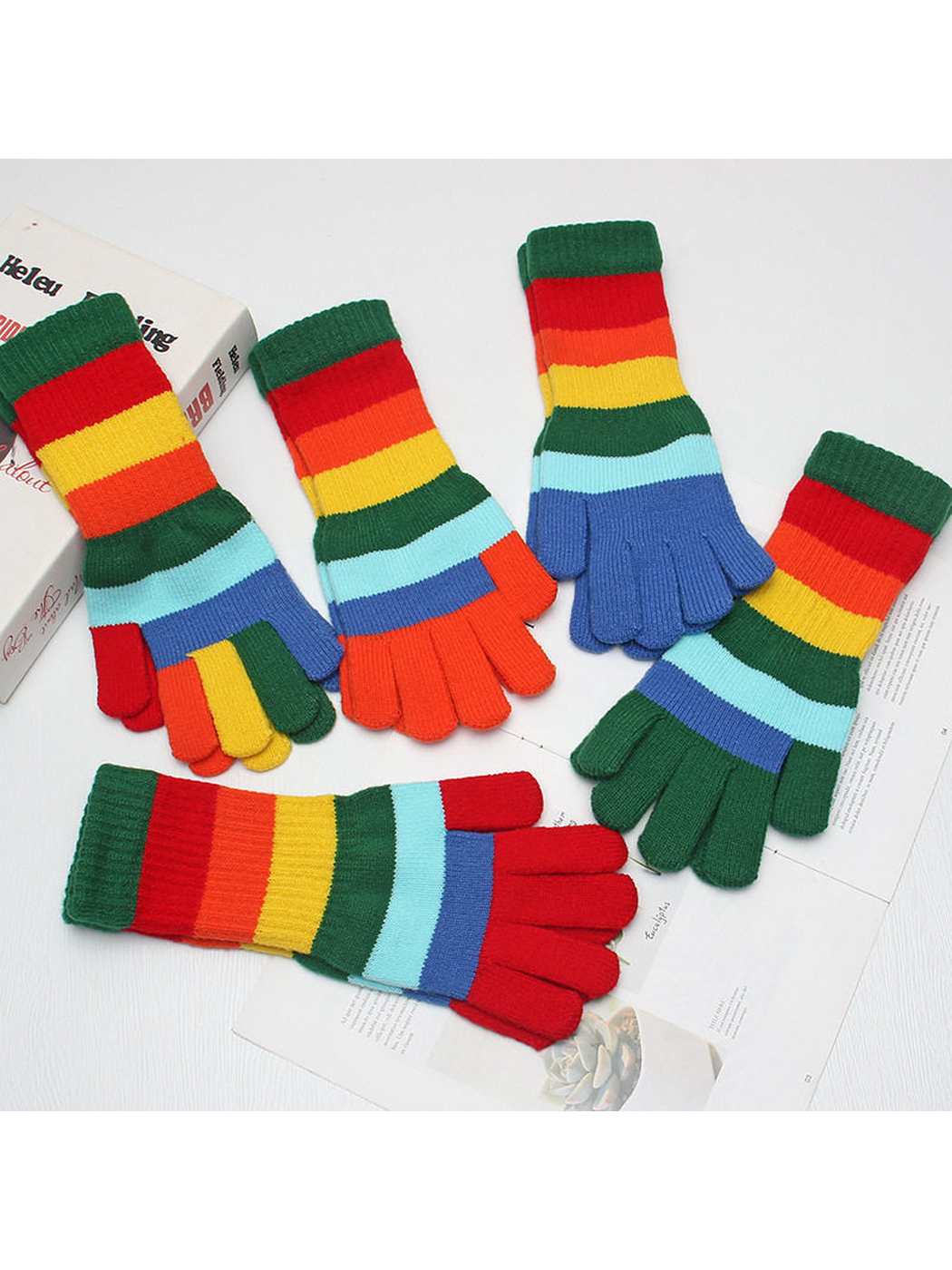 Multiple multicolor striped glove styles arranged together
