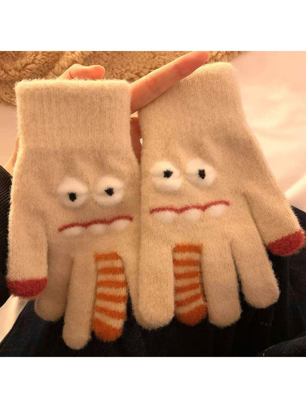 Beige fuzzy cartoon face gloves with raised eyes and striped finger details