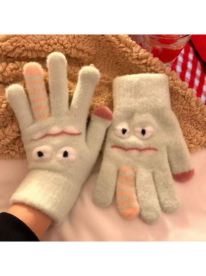 Mint green fuzzy cartoon face gloves with raised eyes and striped finger details