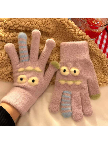 Light purple fuzzy cartoon face gloves with raised eyes and striped finger details