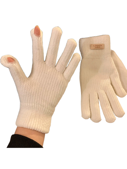White knit gloves with ribbed cuffs and open thumb and index fingertips