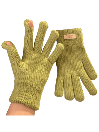 Green knit gloves with ribbed cuffs and open thumb and index fingertips