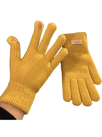 Mustard yellow knit gloves with ribbed cuffs and open thumb and index fingertips