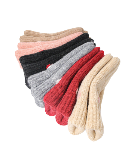 Knit gloves in assorted colors arranged in a fan display