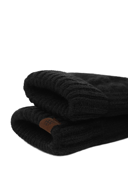 Close-up of the folded ribbed cuffs and brown patch