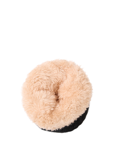 Close-up of the turned-out beige plush interior