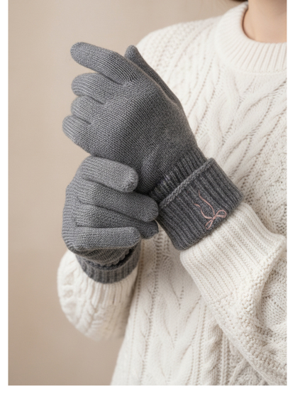 Heather gray bow-embroidered gloves worn with folded ribbed cuffs