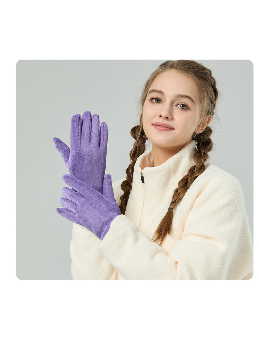 Purple fuzzy-textured gloves worn with a cream jacket
