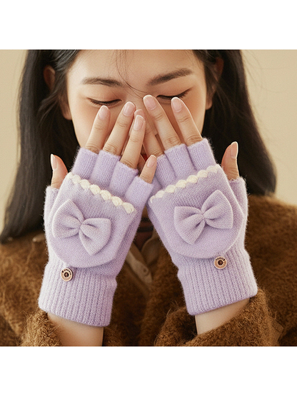 Light purple convertible bow fingerless gloves worn with the fingertips exposed