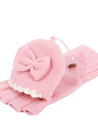 Close-up of the pink bow flap and fastening button