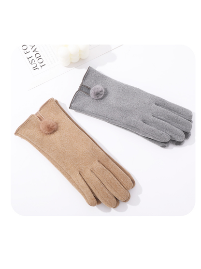 Camel and gray pom-pom gloves arranged together
